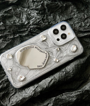 Gem Mirror phone case with pearlescent finish and gemstone accents"